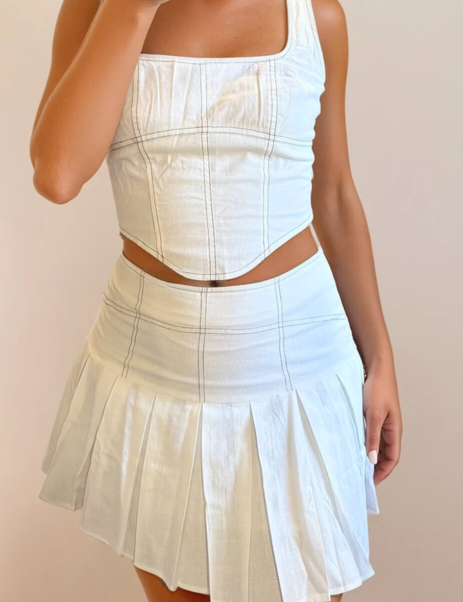 LeniStitchPleatedSkirt_28d671b9-4607-4be4-9d0c-2a3e9679bf02.png
