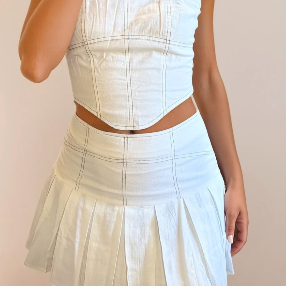 LeniStitchPleatedSkirt_28d671b9-4607-4be4-9d0c-2a3e9679bf02.png